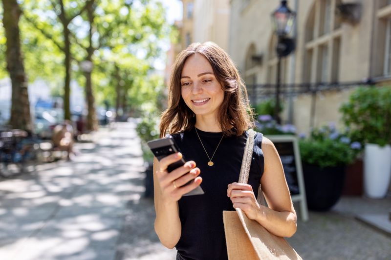 A person looks at their phone. 