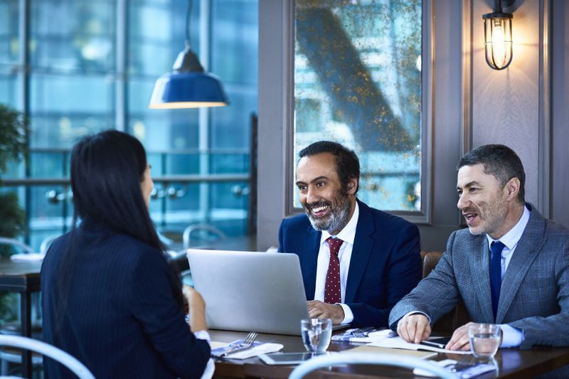 A pair of hedge fund managers meet with a banker who will be handling a large purchase of shares in a listed stock.