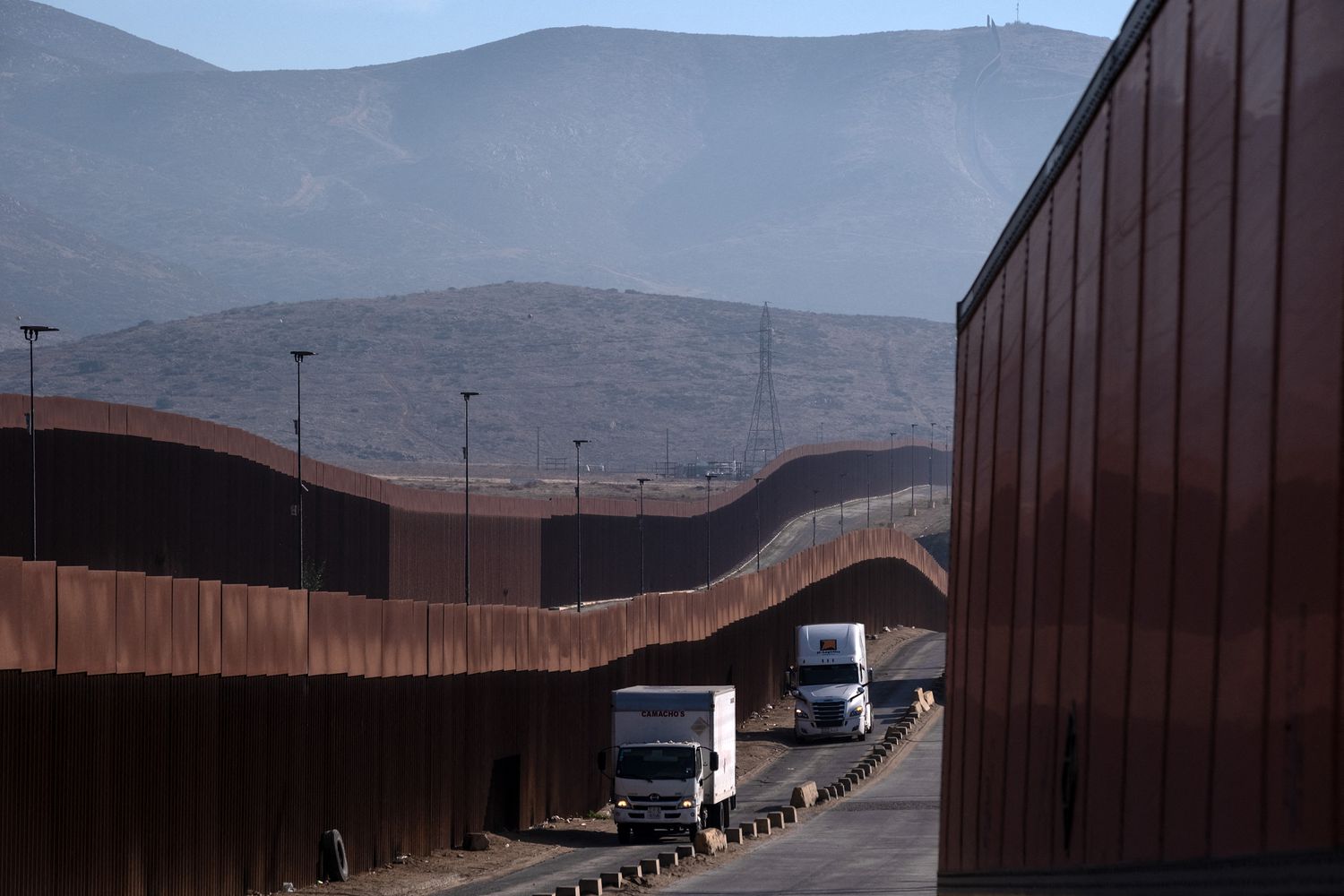 Trucks drive to cross to US at Otay Commercial port in Tijuana, Baja California state, Mexico on January 31, 2025.