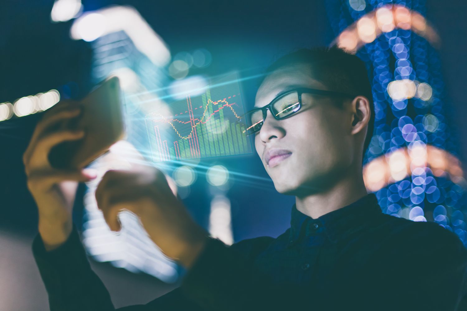 Businessman using futuristic mobile phone.