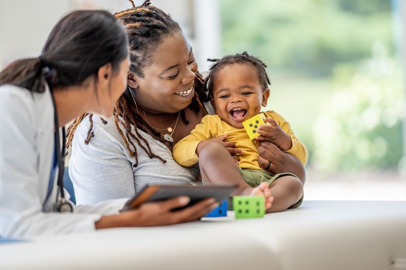 Mother and child in a health check-up paid by their insurance.