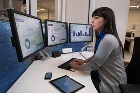 Financial analyst using computers