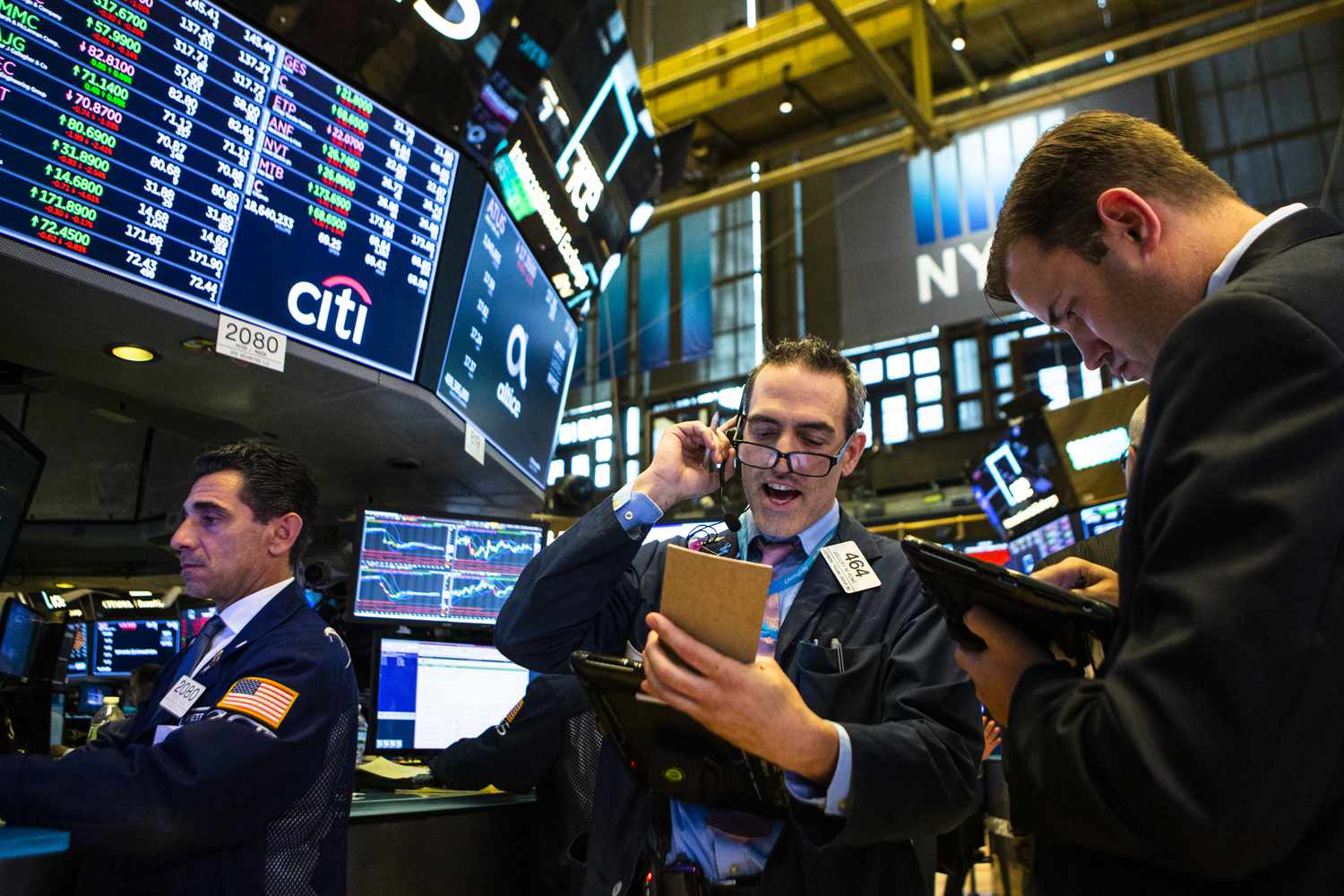 Traders work on the floor of the New York Stock Exchange (NYSE) ahead of the closing bell