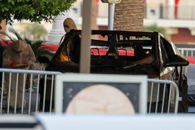 First responders wearing Hazmat gear investigate a Tesla Cybertruck that exploded in front of the entrance to the Trump International Hotel & Tower Las Vegas on January 01, 2025 in Las Vegas, Nevada