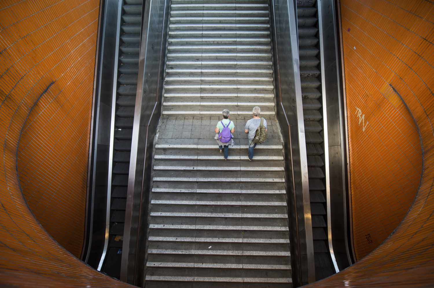 Two persons go upstairs from an underpass on August 17, 2016 in Berlin, Germany.