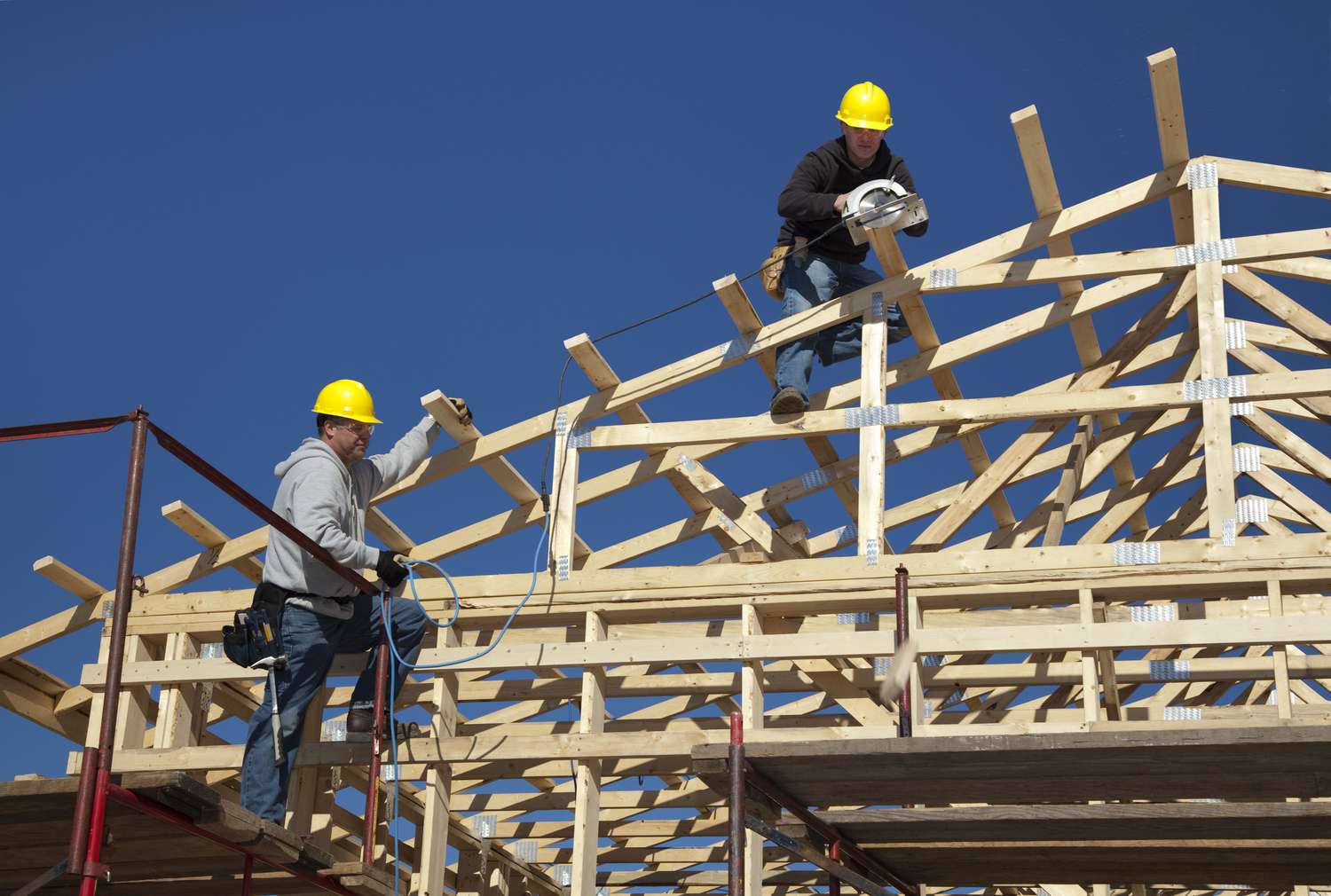 Construction workers building a home