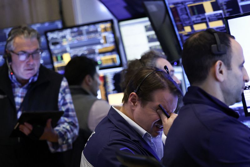 Traders work on the floor of the New York Stock Exchange 