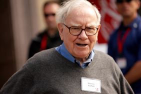 Warren Buffett smiling at camera.