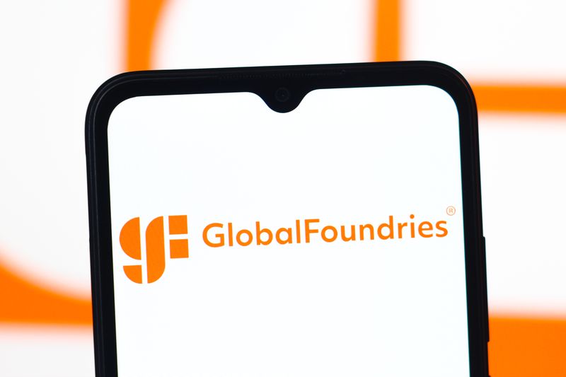 The GlobalFoundries logo is seen displayed on a smartphone screen
