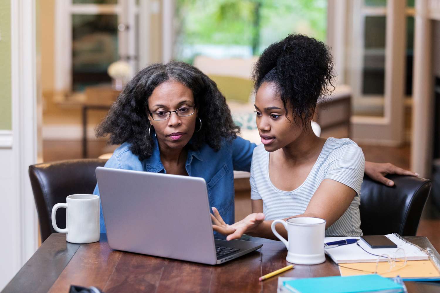 Mother discussing with her child how she's going to pay for her college education