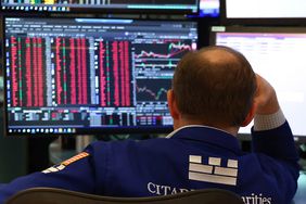 A trader works on the floor of the New York Stock Exchange 