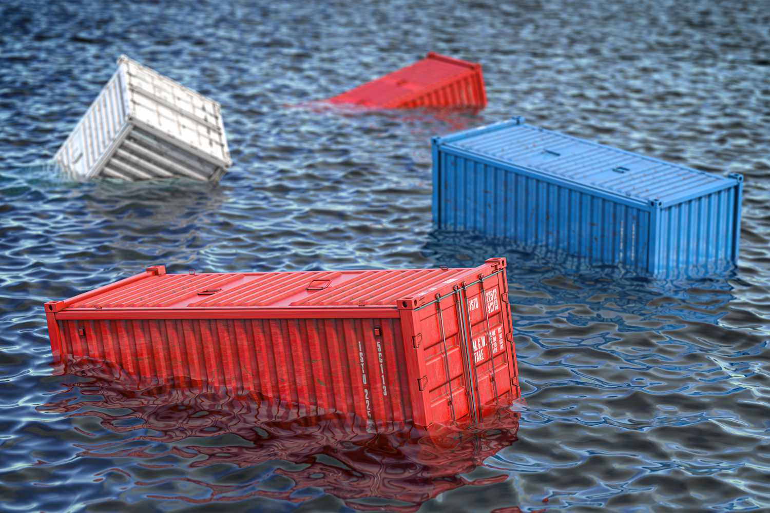 Several shipping containers float in the ocean after falling off a cargo ship