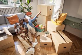 A couple with a baby in their new home