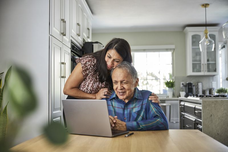 Mother and father at a computer