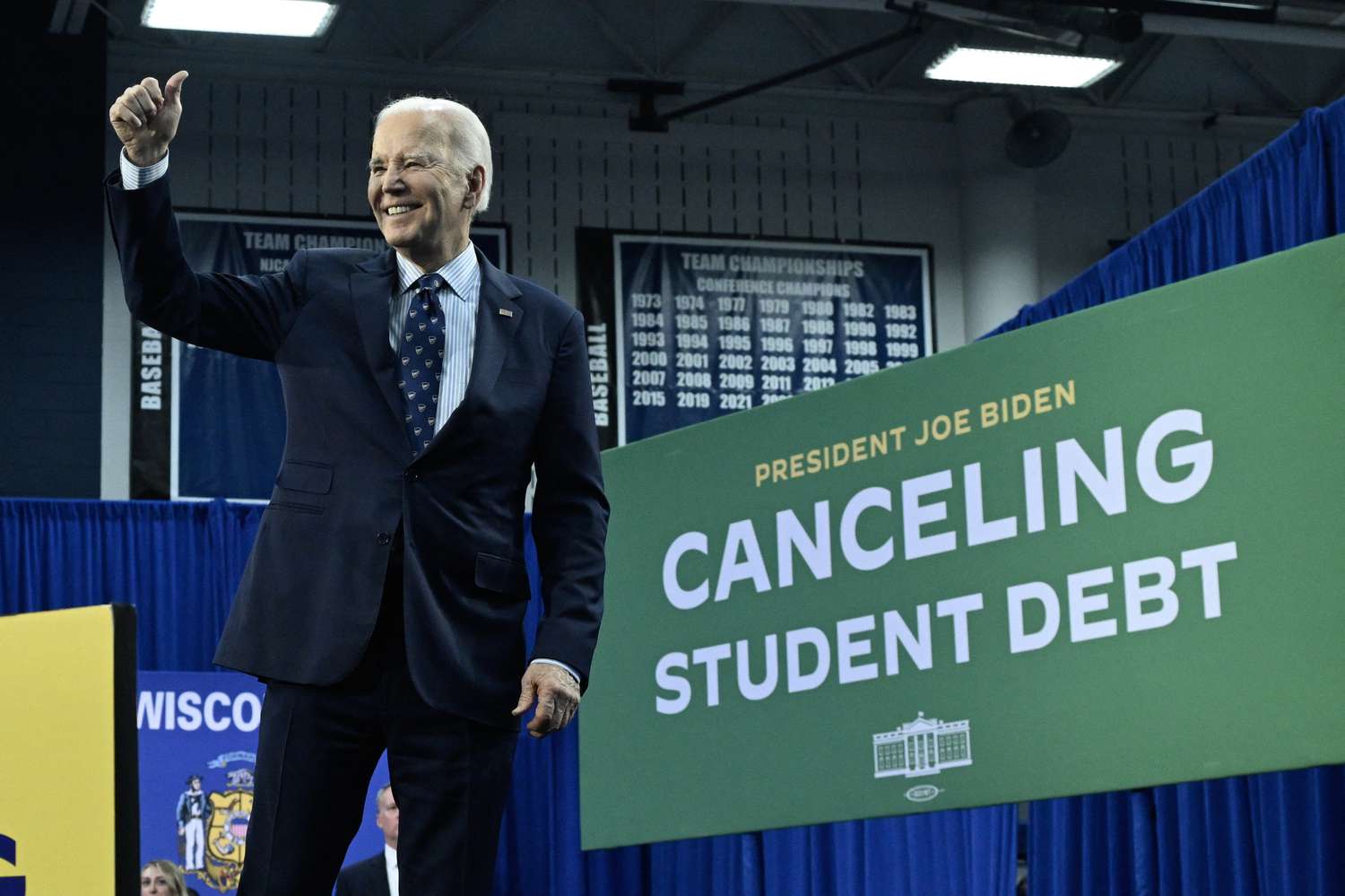 US President Joe Biden gestures after speaking about student loan debt relief at Madison Area Technical College in Madison, Wisconsin, April 8, 2024.