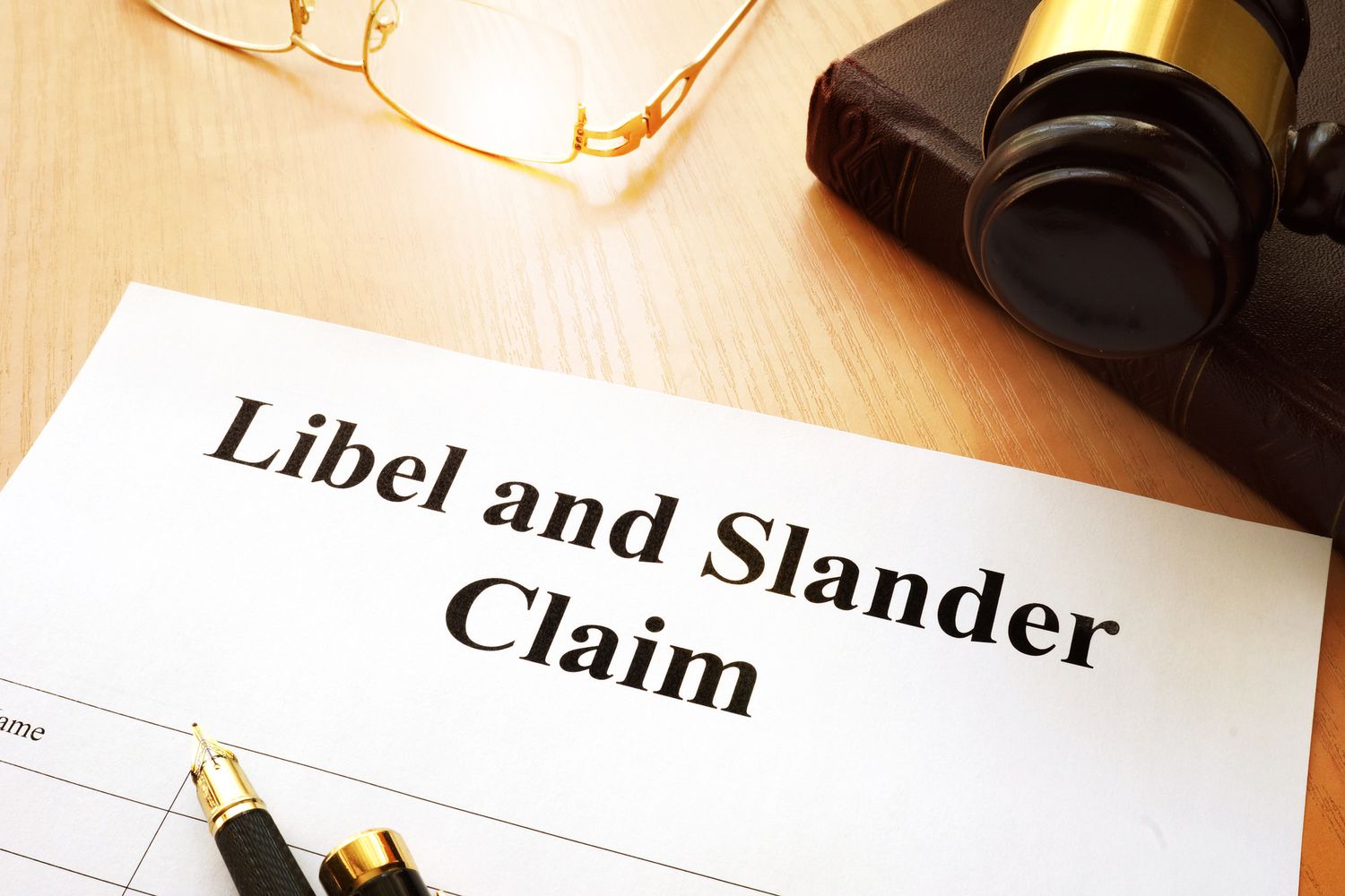 Libel and Slander Claims on a desk.