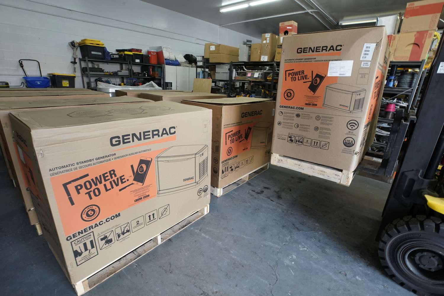 Generac home generators being unloaded at an appliance store