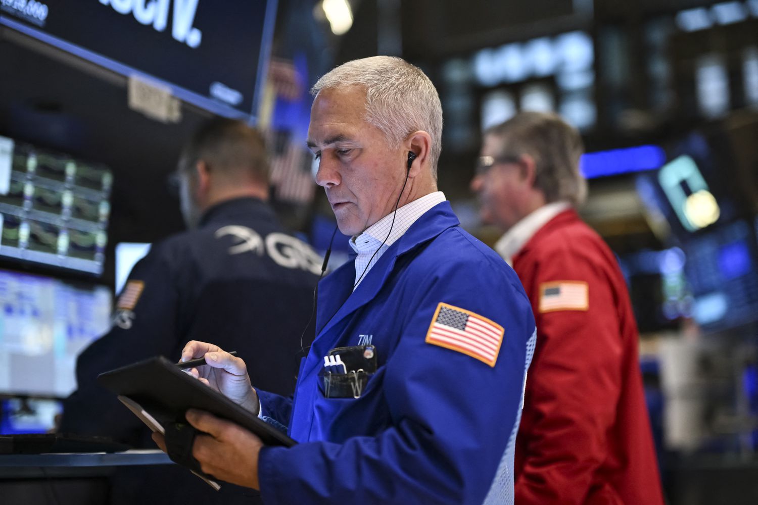 Traders work on the floor of the New York Stock Exchange