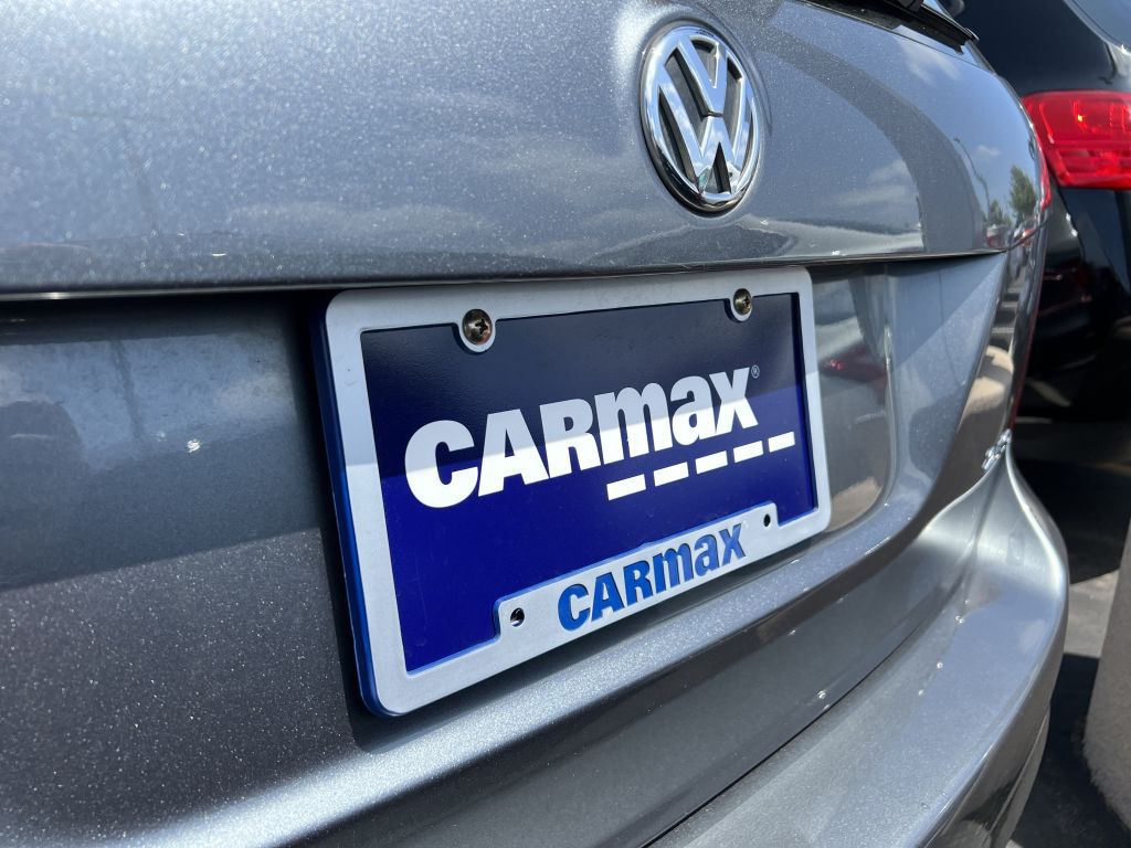 Close up of a Volkswagen car with visible CarMax logo, license plate, and automotive lighting at Auto Mall Parkway, Fairfield, California, May 25, 2023.