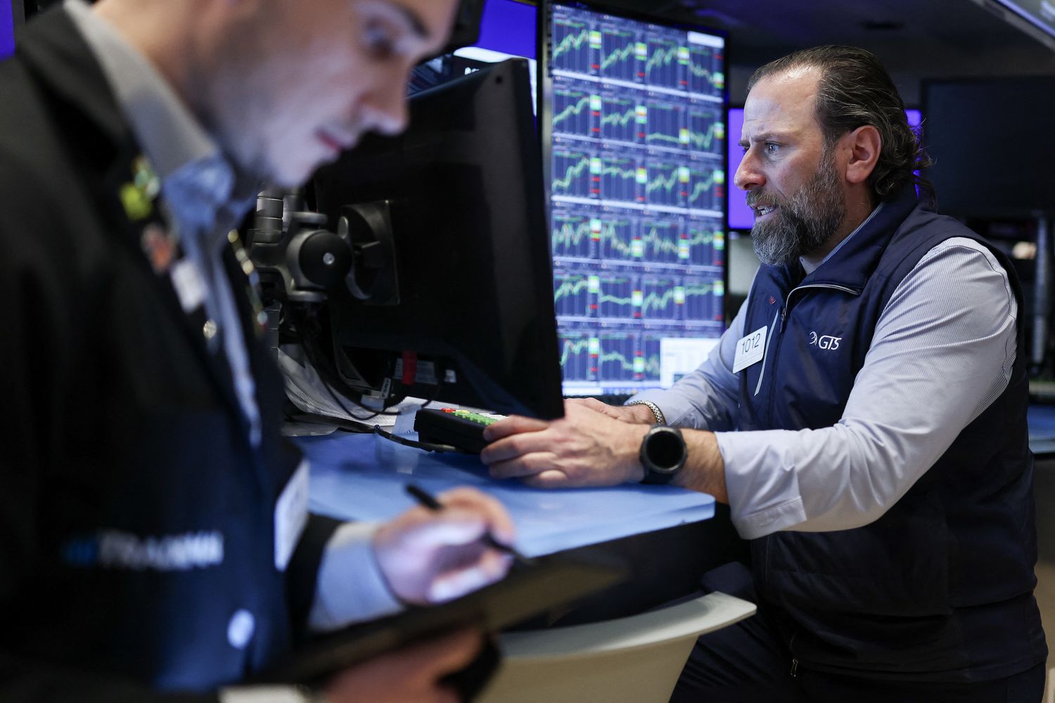 Traders work on the floor of the New York Stock Exchange