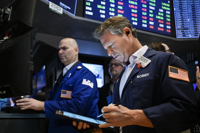 Traders work on the floor of the New York Stock Exchange 