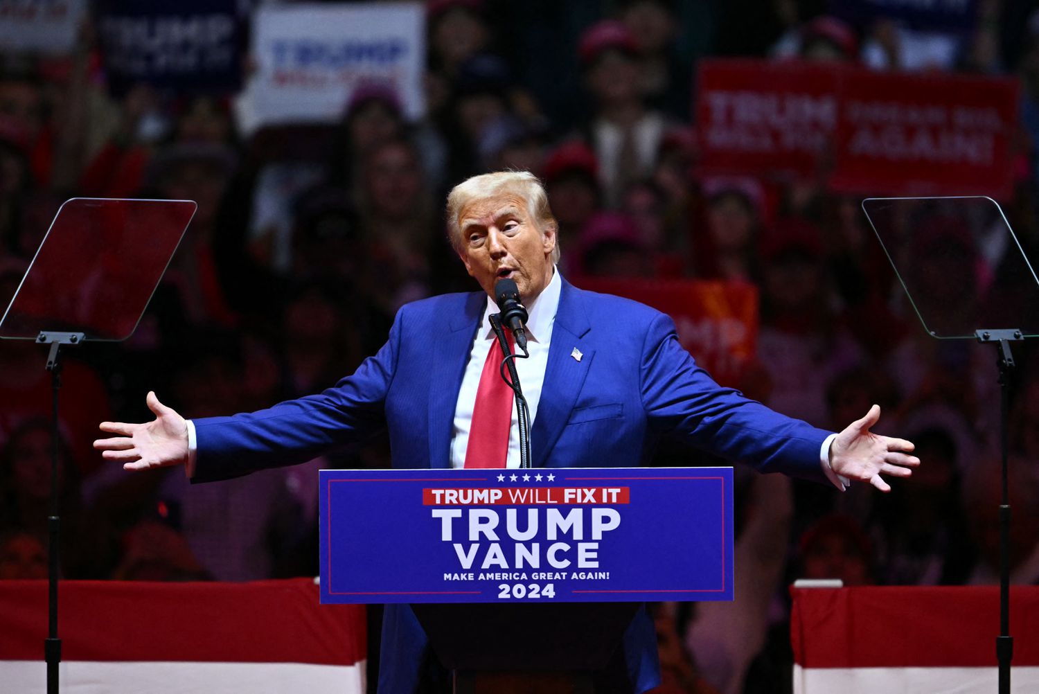 Former US President and Republican presidential candidate Donald Trump gestures as he speaks during a campaign rally at Madison Square Garden in New York, October 27, 2024. 