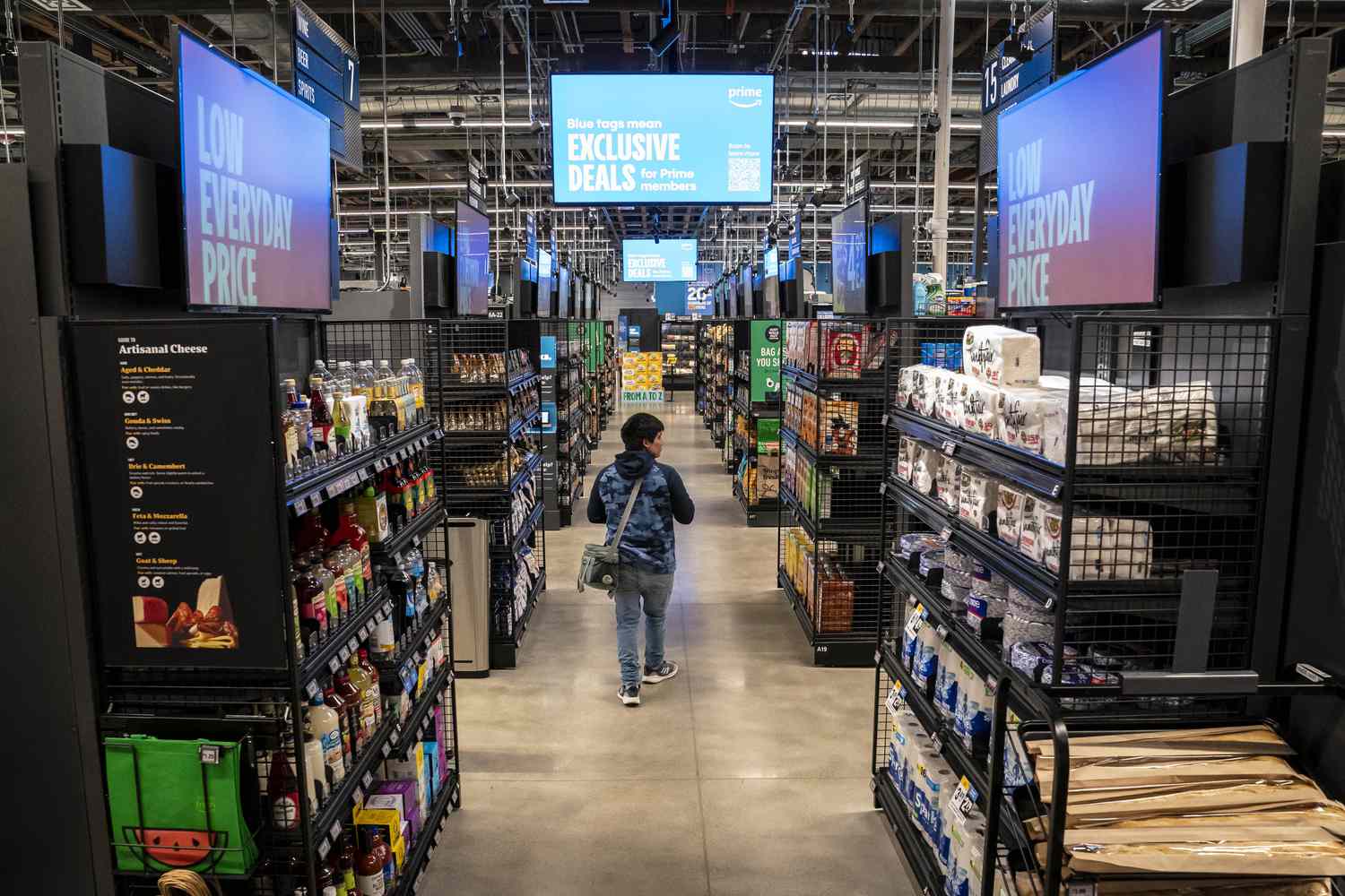 A shopper walks through an Amazon Fresh grocery store in Seattle, Washington, US, on Thursday, May 2, 2024.