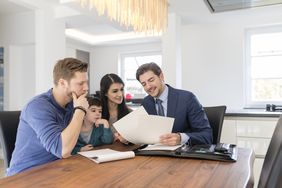 Consultant talking to family at home