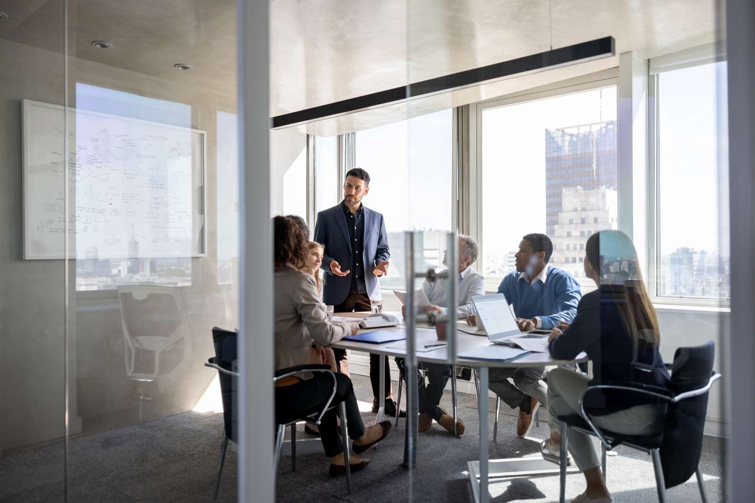 A business meeting in an office with a group of shareholders to agree on course of action 
