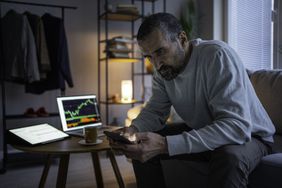 Crypto trader sitting at home and looking up information about ZK-SNARK to make the decision of investing in Zcash.