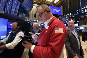 Traders work on the floor of the New York Stock Exchange (NYSE) at the opening bell on May 19, 2025, in New York City.