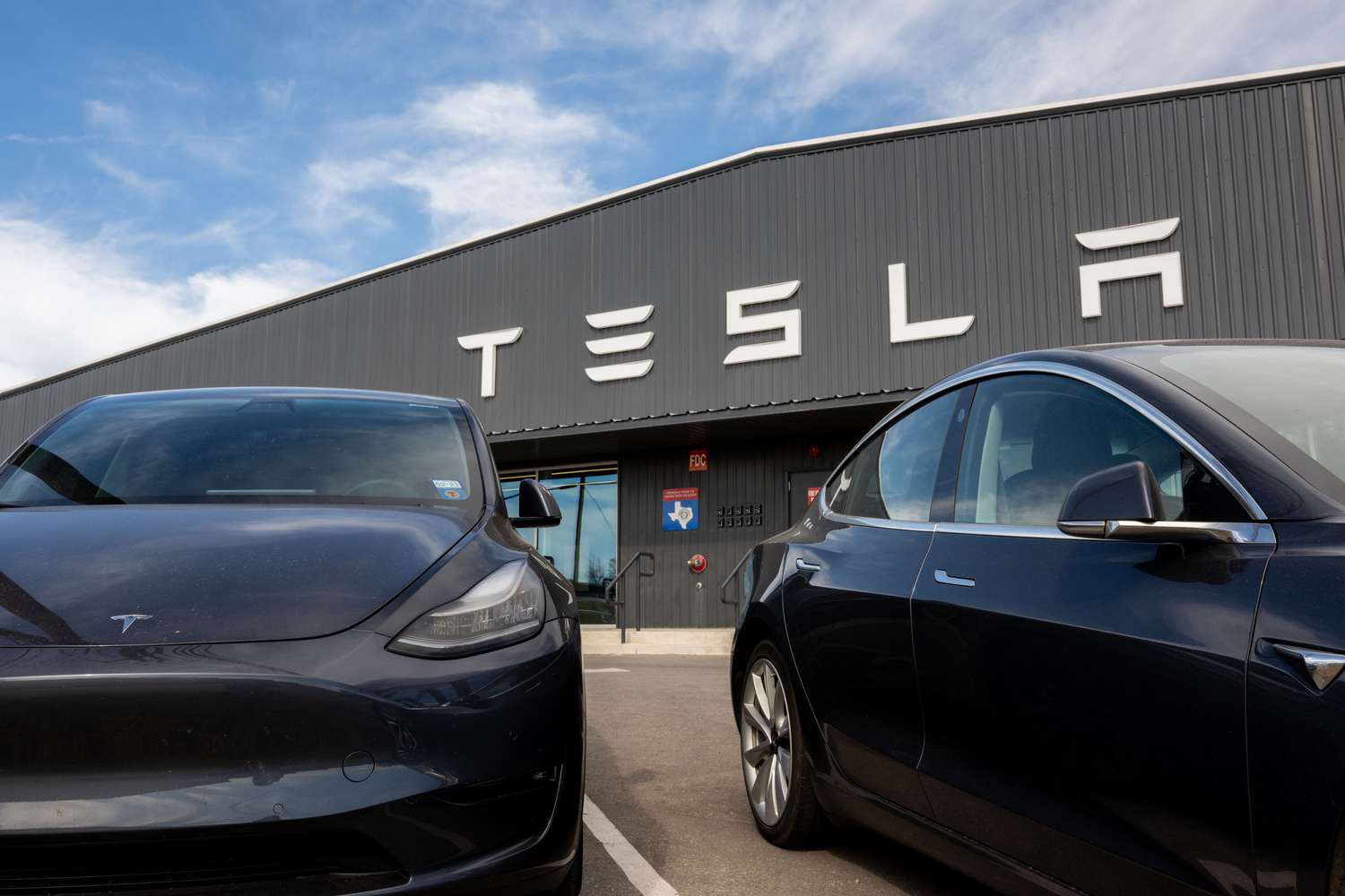 Tesla cars are seen on a lot at a Tesla dealership on January 03, 2023 in Austin, Texas.