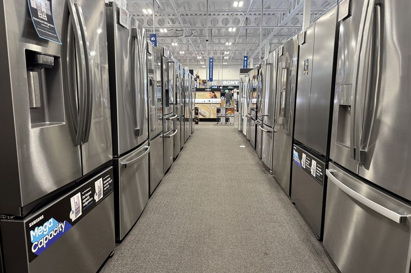 An aisle between rows of new refrigerators at a Best Buy in California in March. 