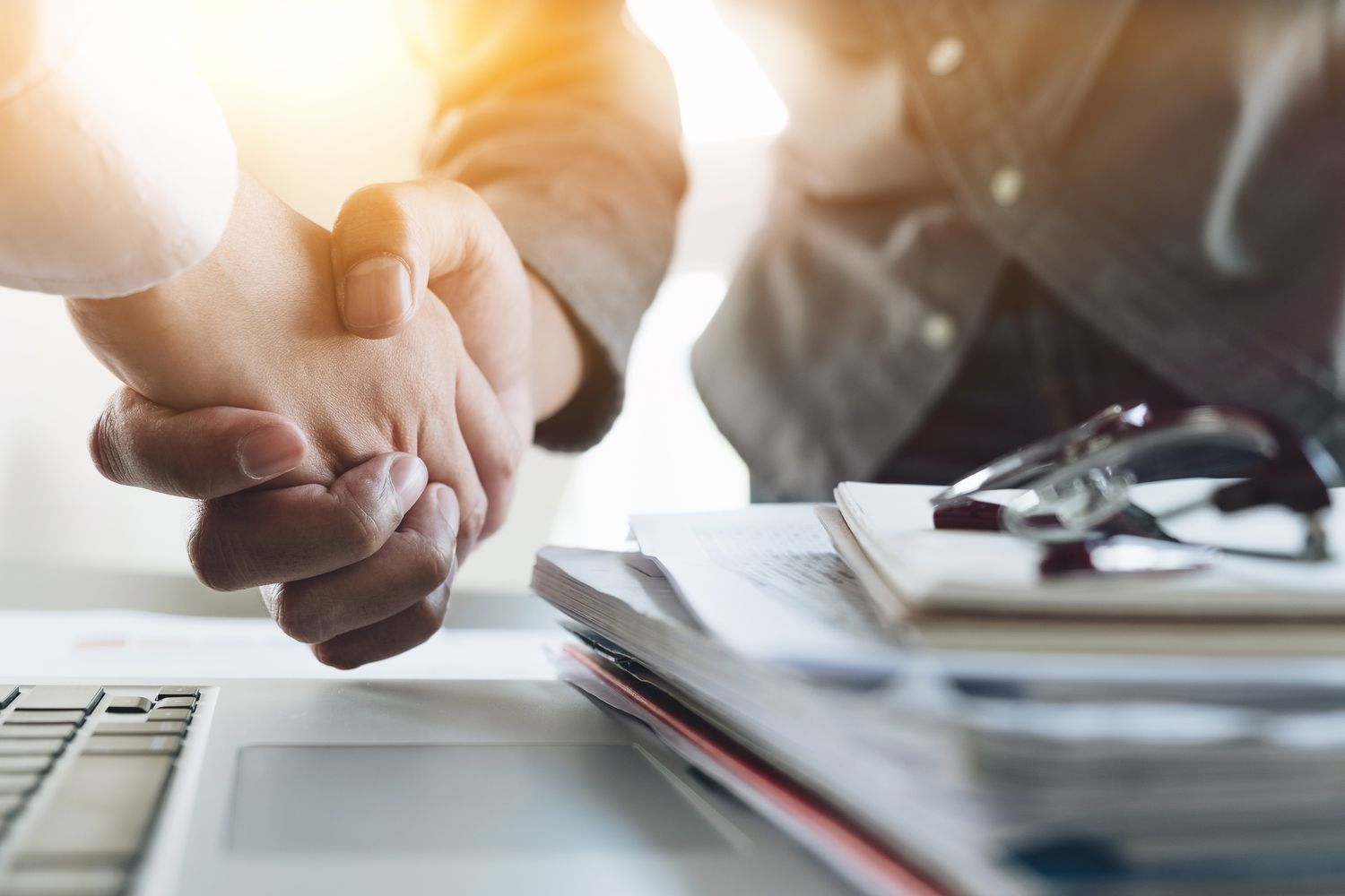 Business people shaking hands.