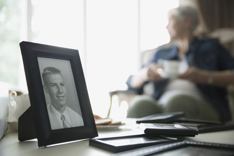 Old photograph of man with senior woman in background