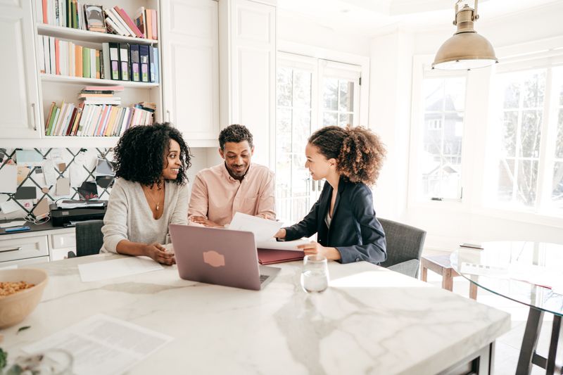 financial advisor speaking with couple