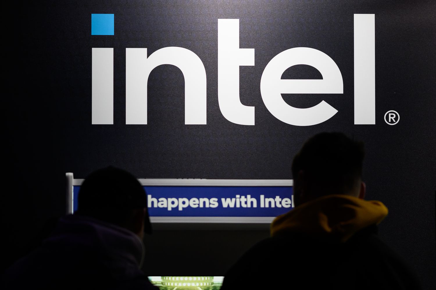 The Intel logo is seen as Esport competitors take part in a gaming tournament.