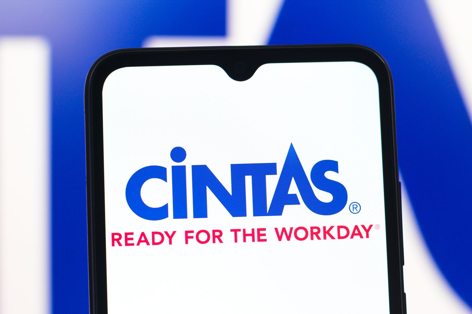 Cintas Corporation logo is seen displayed on a smartphone screen