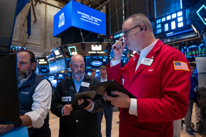  Traders work on the floor of the New York Stock Exchange (NYSE) on May 19, 2025 in New York City. 