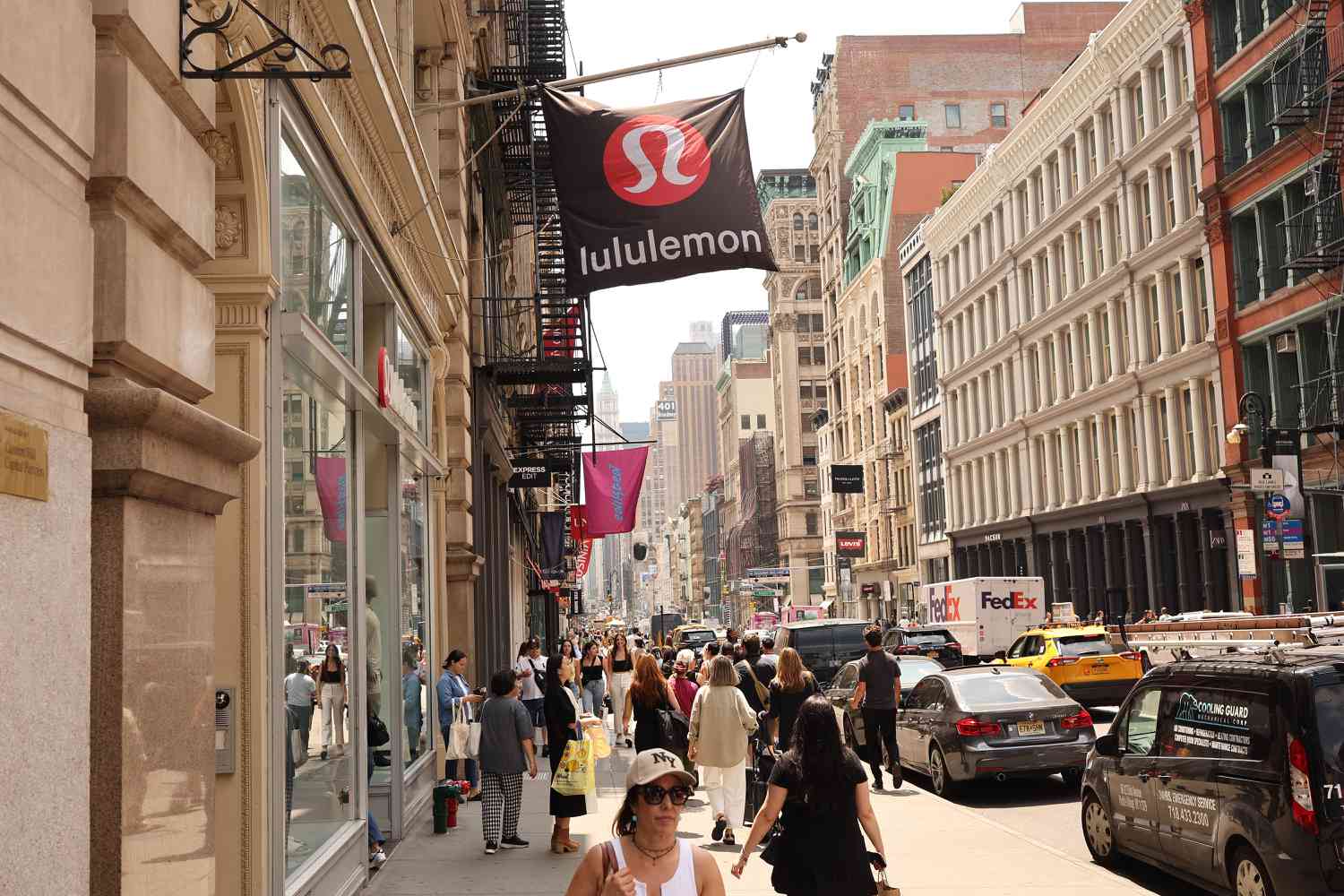 People walk past a Lululemon department store on June 05, 2024 in New York City