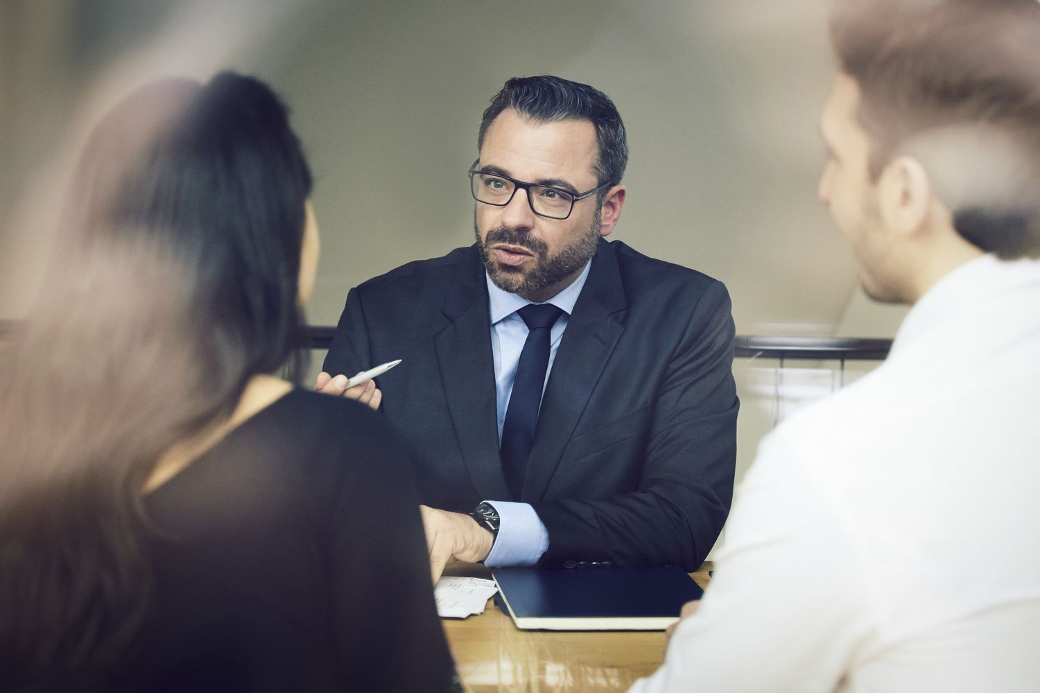 A lawyer meets with clients.