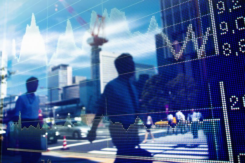 Reflection of stock market graph in window.