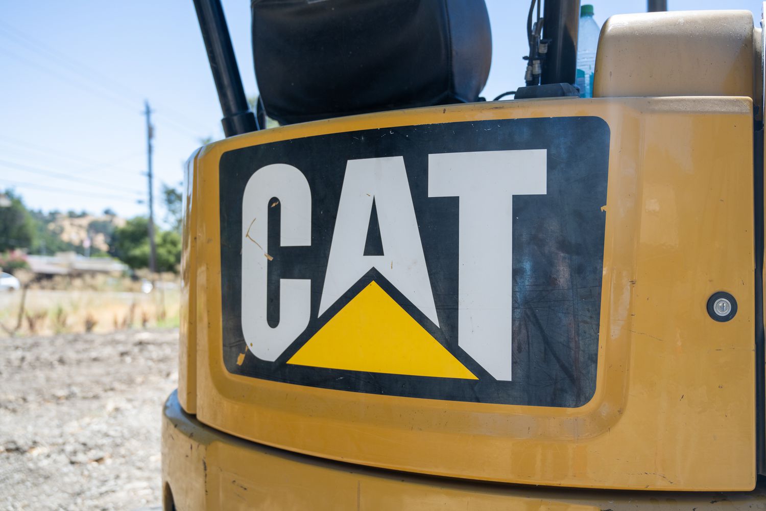 Close-up of CAT (Caterpillar Inc) logo on construction equipment