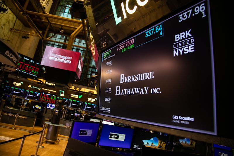 A screen displaying Berkshire Hathaway appears on the floor of the New York Stock Exchange