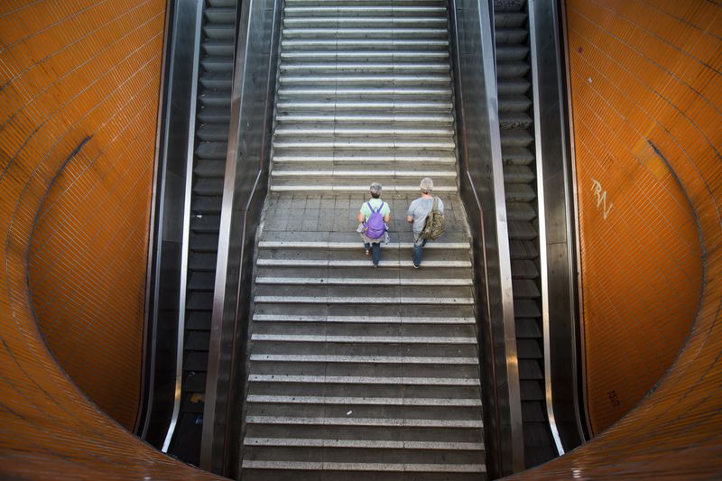 Two persons go upstairs from an underpass on August 17, 2016 in Berlin, Germany.
