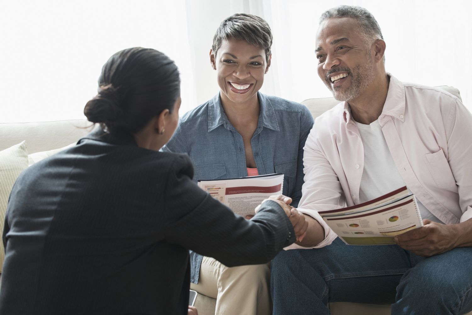 Couple meets with a retirement planner to discuss investing options