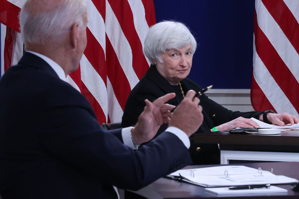 WASHINGTON, DC - OCTOBER 06: U.S. Treasury Secretary Janet Yellen (C) listens to President Joe Biden during a hybrid meeting with corporate chief executives and members of his cabinet to discuss the looming federal debt limit in the South Court Auditorium in the Eisenhower Executive Office Building on October 06, 2021 in Washington, DC. Each of the meeting participants spoke in dire terms about the negative national and global economic reaction to Congress failing to raise the limit and the U.S. defaulting on its debt.