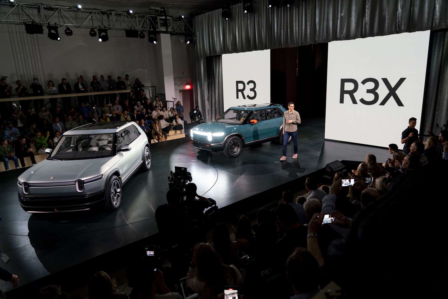 Rivian CEO RJ Scaringe unveils Rivian R3 and R3X prototype crossover electric vehicles during an event in Laguna Beach, California on March 7, 2024.