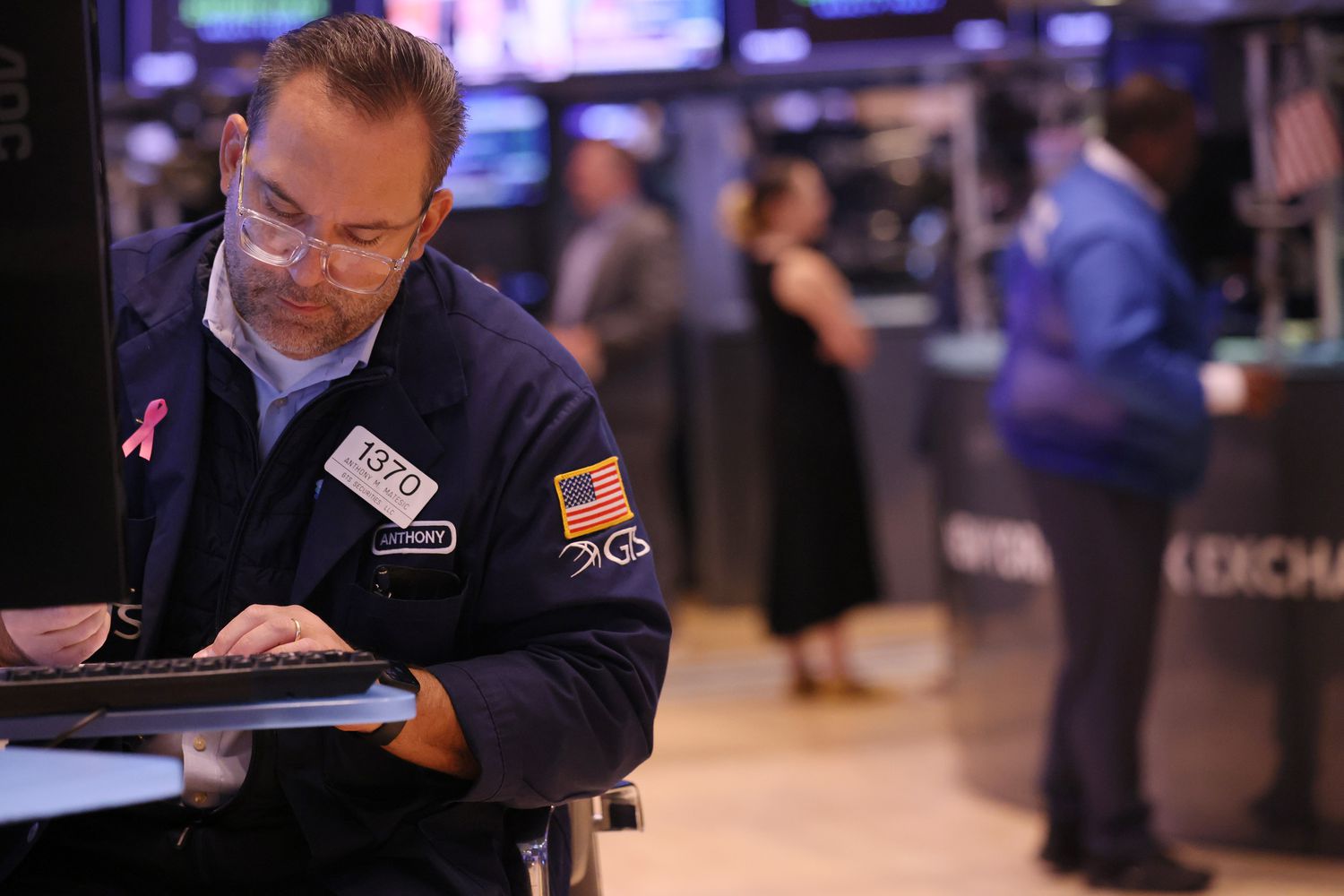 Traders work on the floor of the New York Stock Exchange.