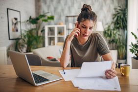 A person calls the opt-out number to stop receiving junk mail about credit card offers.